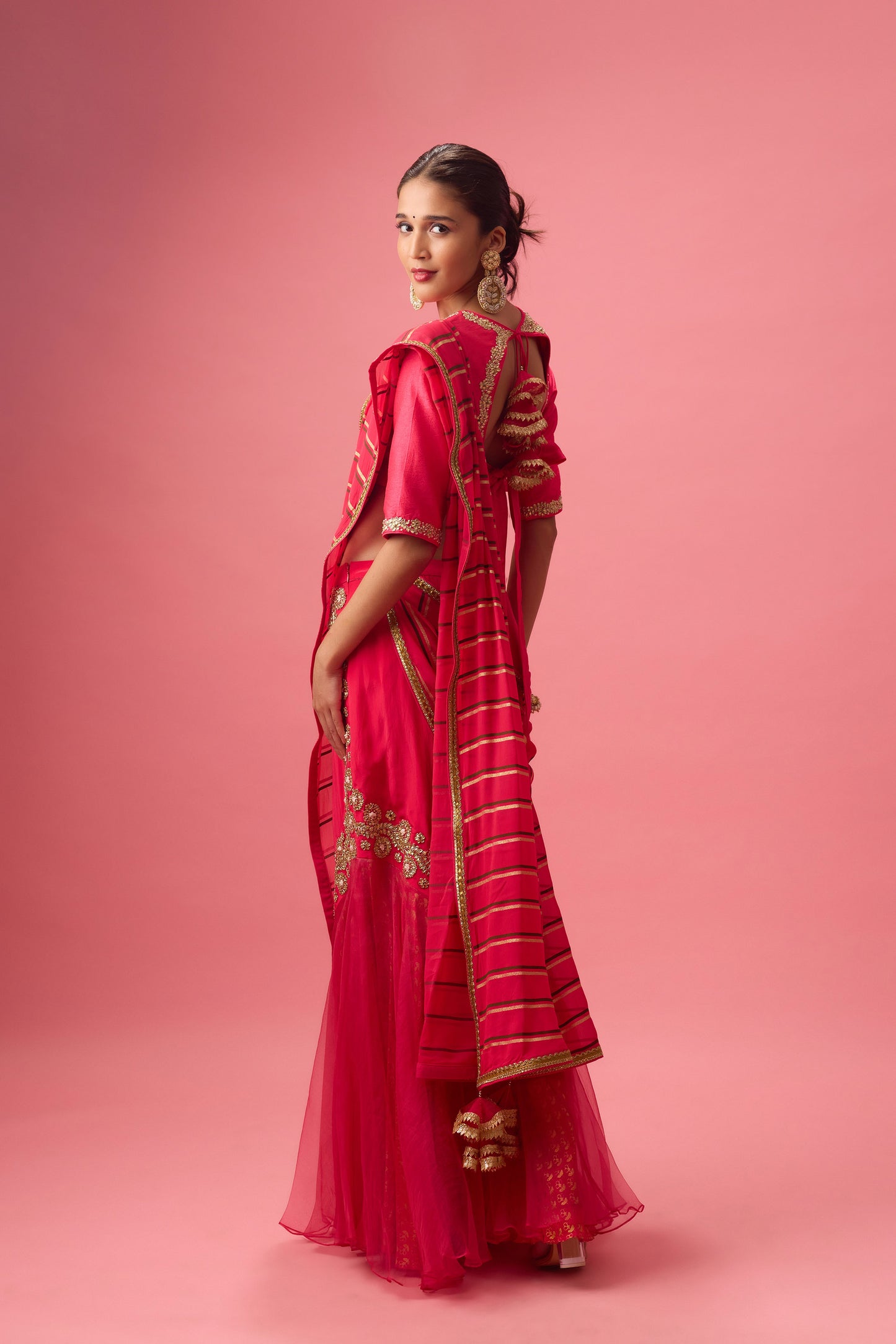 Rani Pink Double layer hand embroidered Organza lehenga paired with emb. Blouse and dupatta