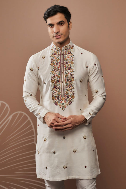 White silk kurta set with hand and machine work
