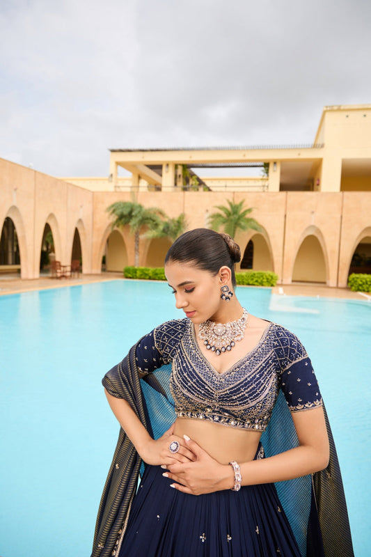 Royal blue silk lehenga choli with golden thread embroidery and sequins work