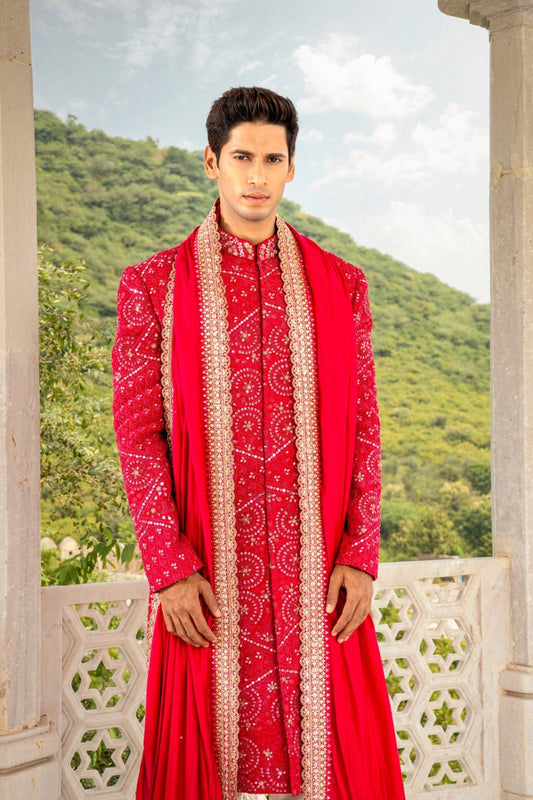Vibrant red silk sherwani with hand cut dana and sequins work