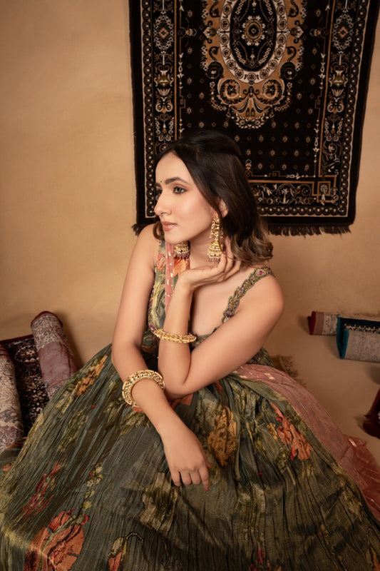 Sage green tissue printed silk lehenga choli with knot and cut dana work