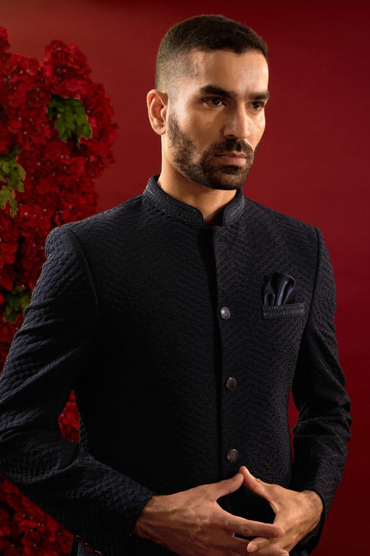 Black silk suit with hand work on neckline and pocket