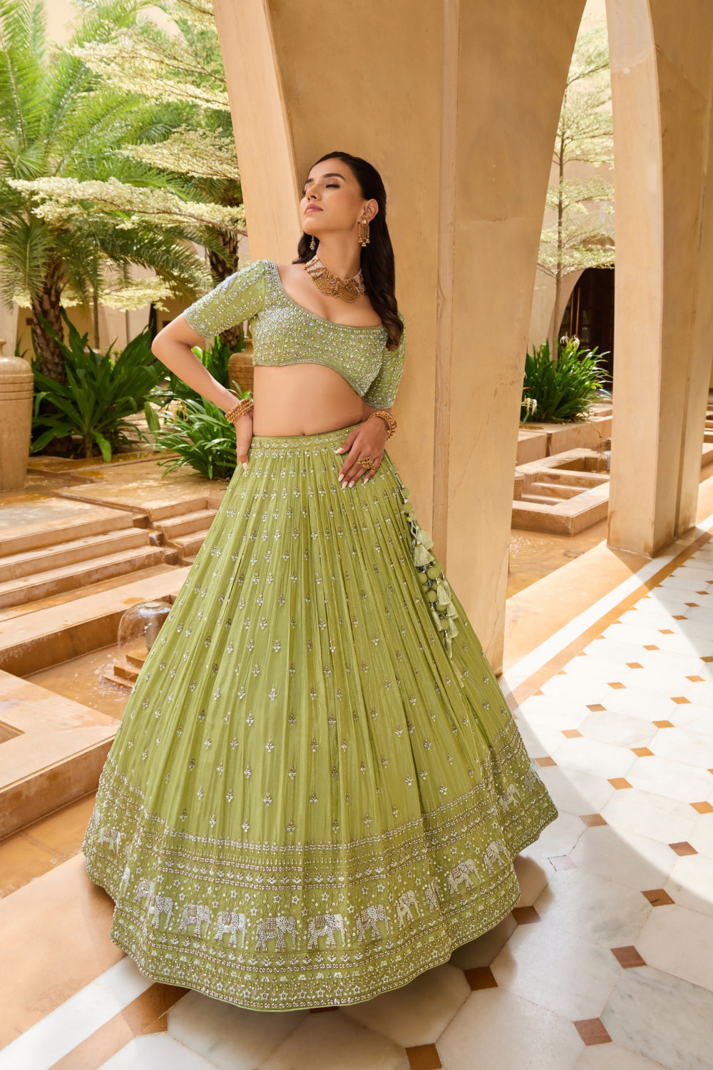 Palm green silk lehenga choli with sequins and hand cut dana work