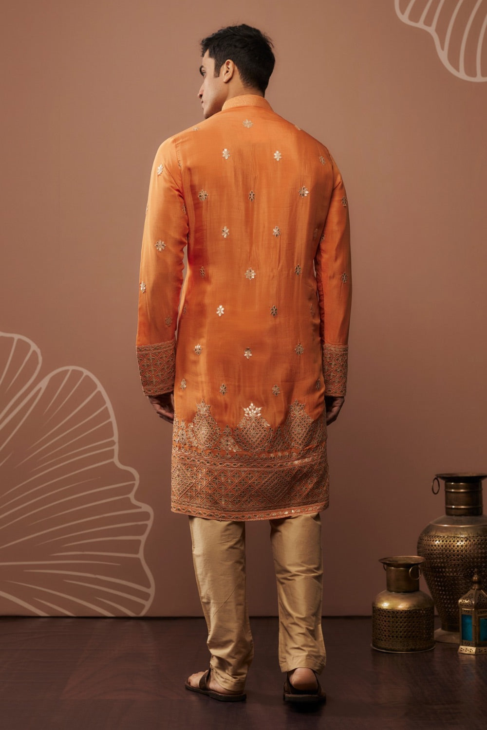 Orange silk kurta set with hand and machine work