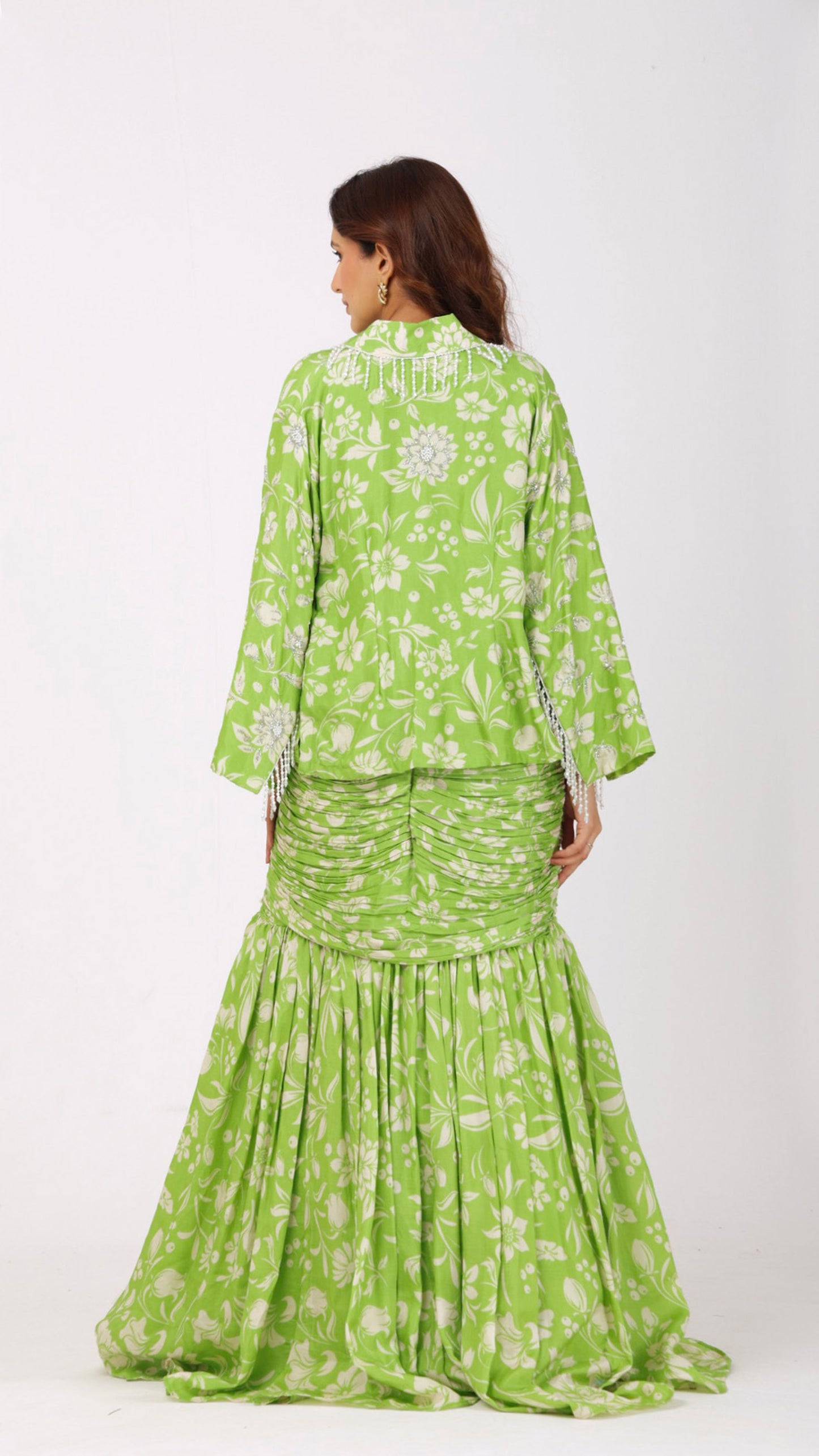 Love Bird Green Floral fish-cut ruched skirt and choli set paired with a hand-embroidered jacket