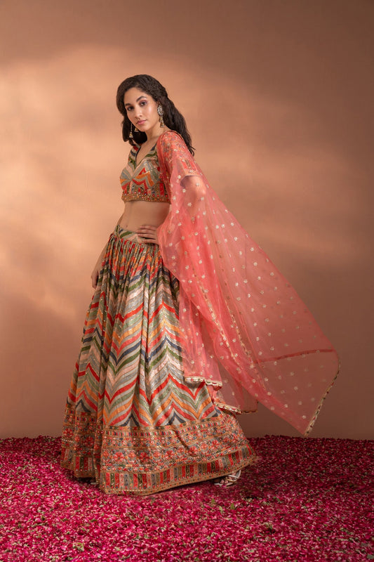 Multi Colour Lehenga set in Cotton-Satin Fabric with heavy threadwork, sequence, arri work & Net Dupatta.