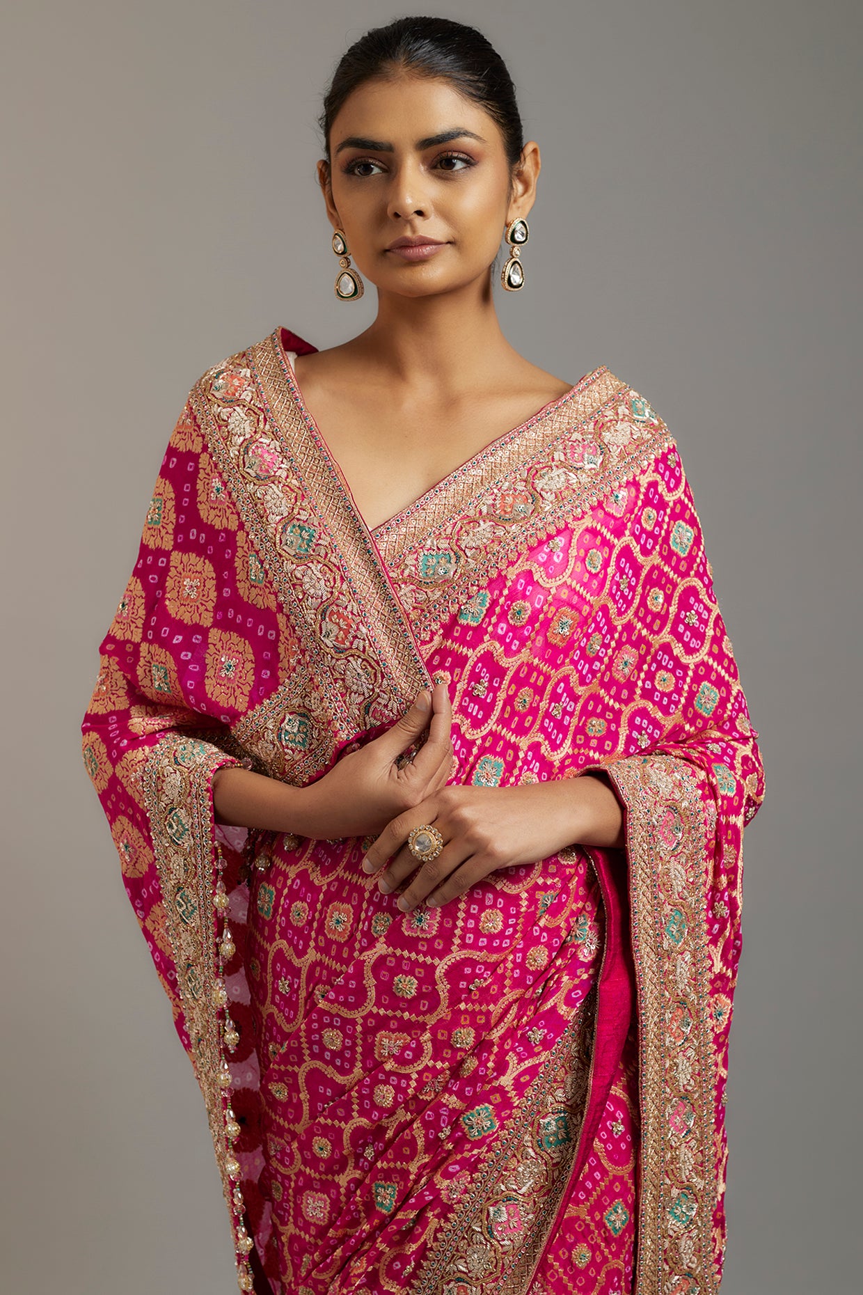 rani pink silk sequins embellished bandhej patola saree set