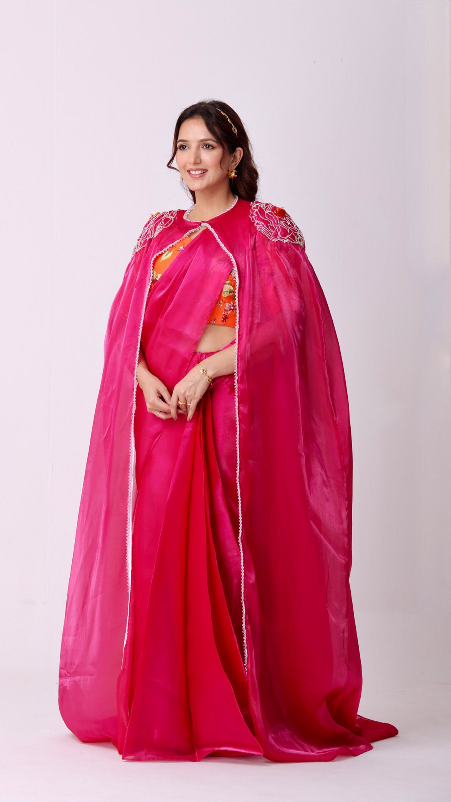 Fuchsia statement saree and embroidered cape with floral embellished blouse