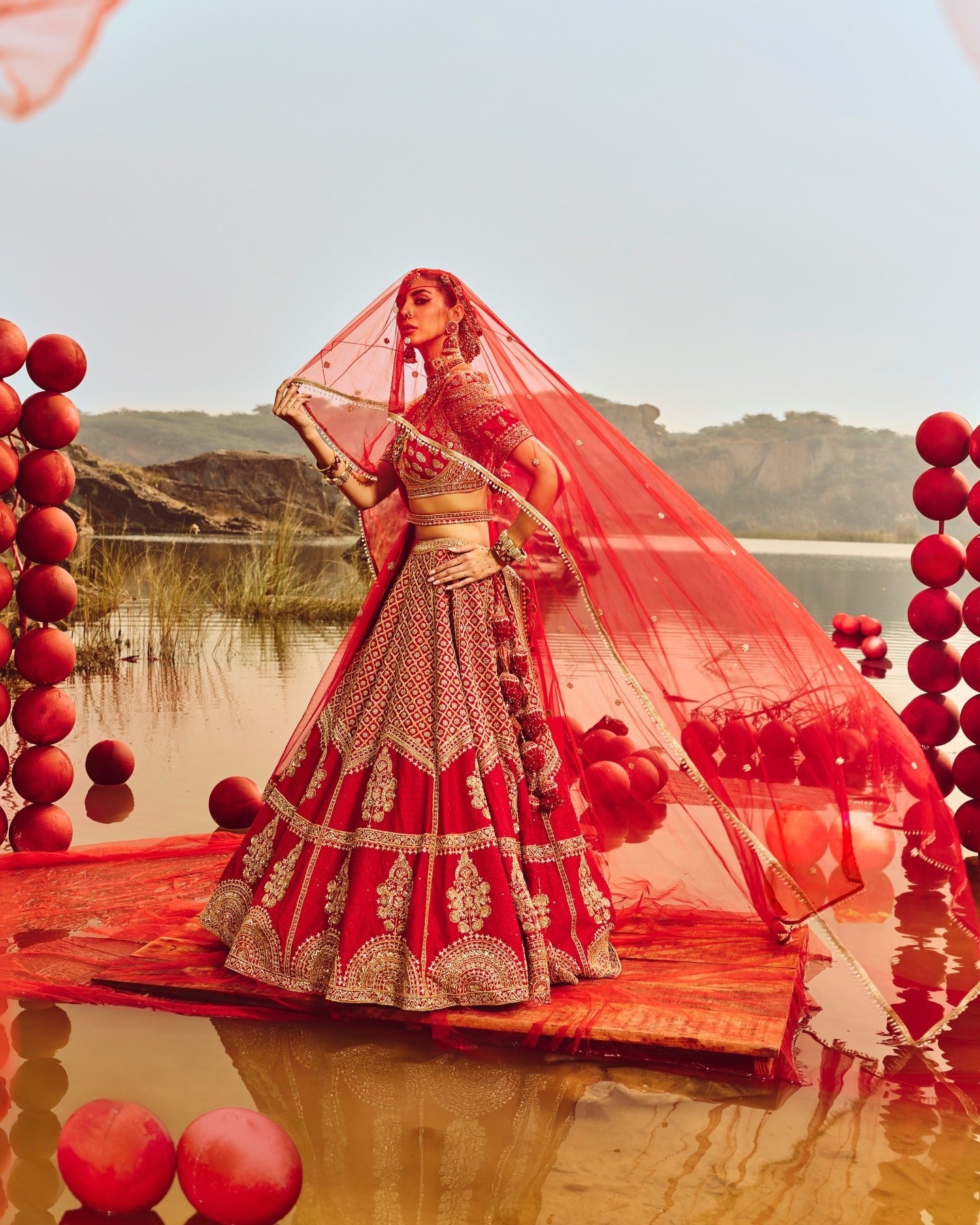 Red Heavy Butti Embellished Silk Bridal Lehenga