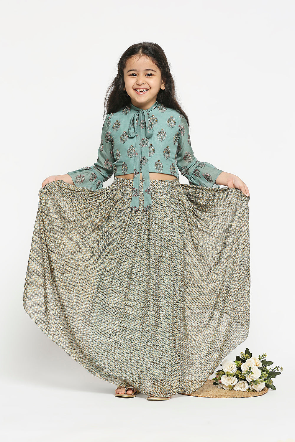 Muasir Printed Skirt Paired With Crop Top Which Has Bell Sleeves And Neck Tie Up