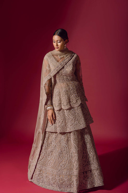 Ravishing Beige Peplum Jacket Velvet Lehenga Set