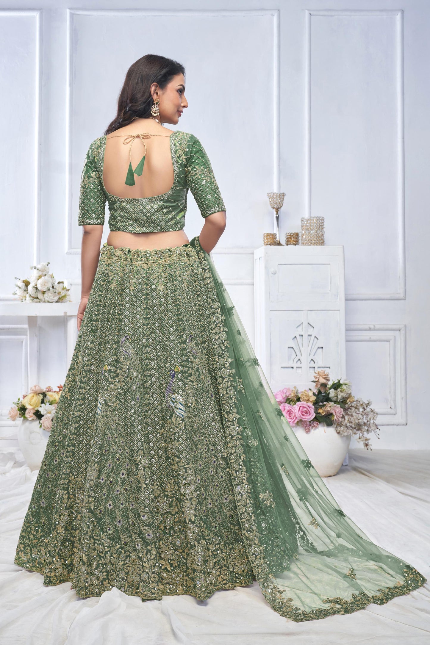 Green Heavy Sequins & Zari Embroidered Soft Net Bridal Wear Lehenga