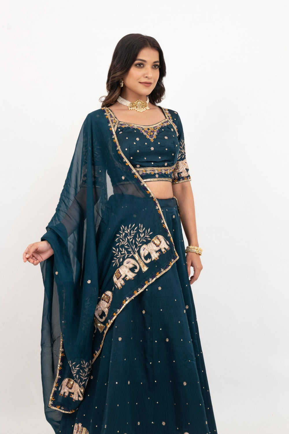 Peacock blue soft silk zardozi embroidered lehenga choli with hand cut dana work
