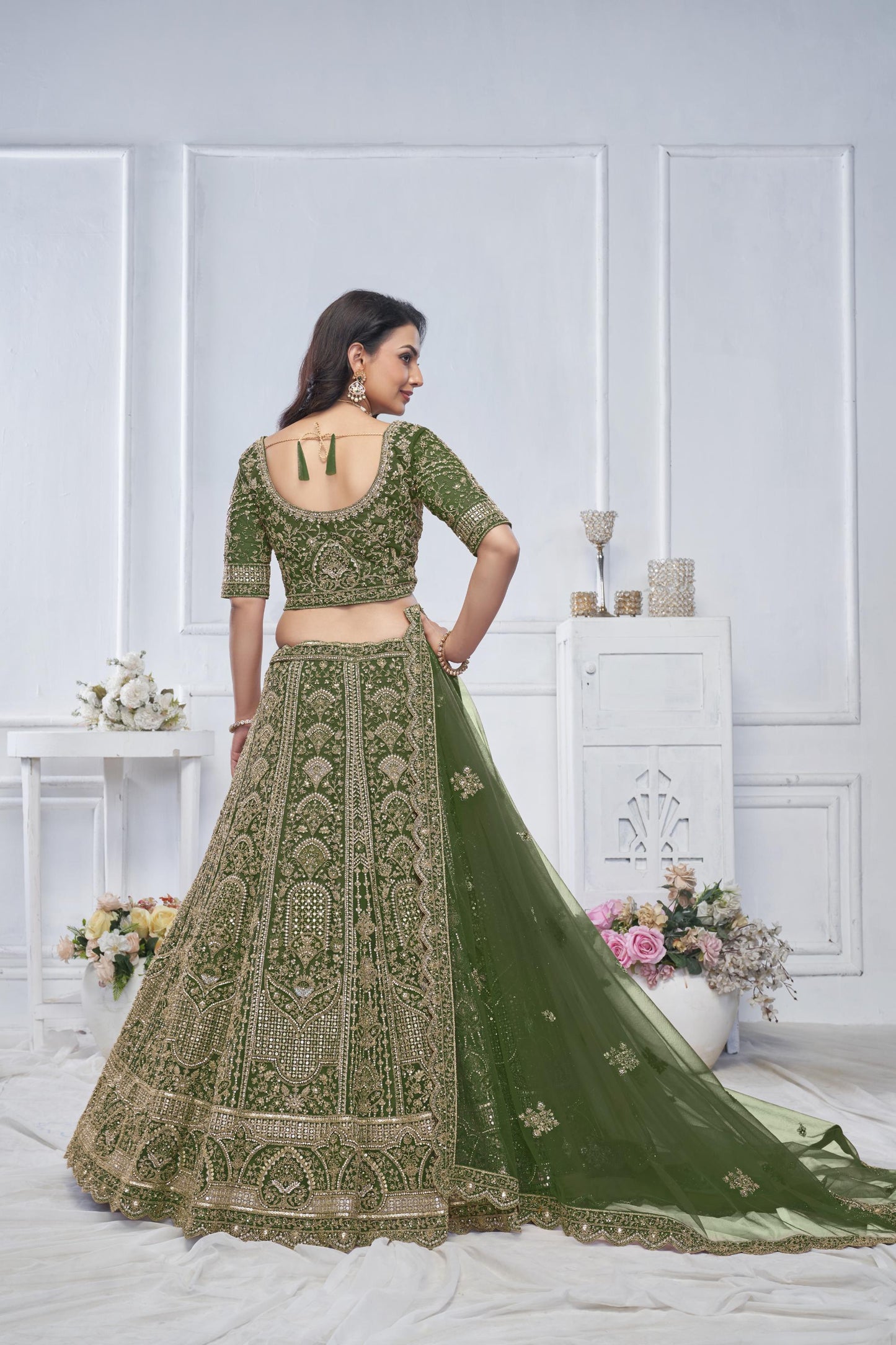 Peacock Green Motif Embroidered Soft Net Bridal lehenga