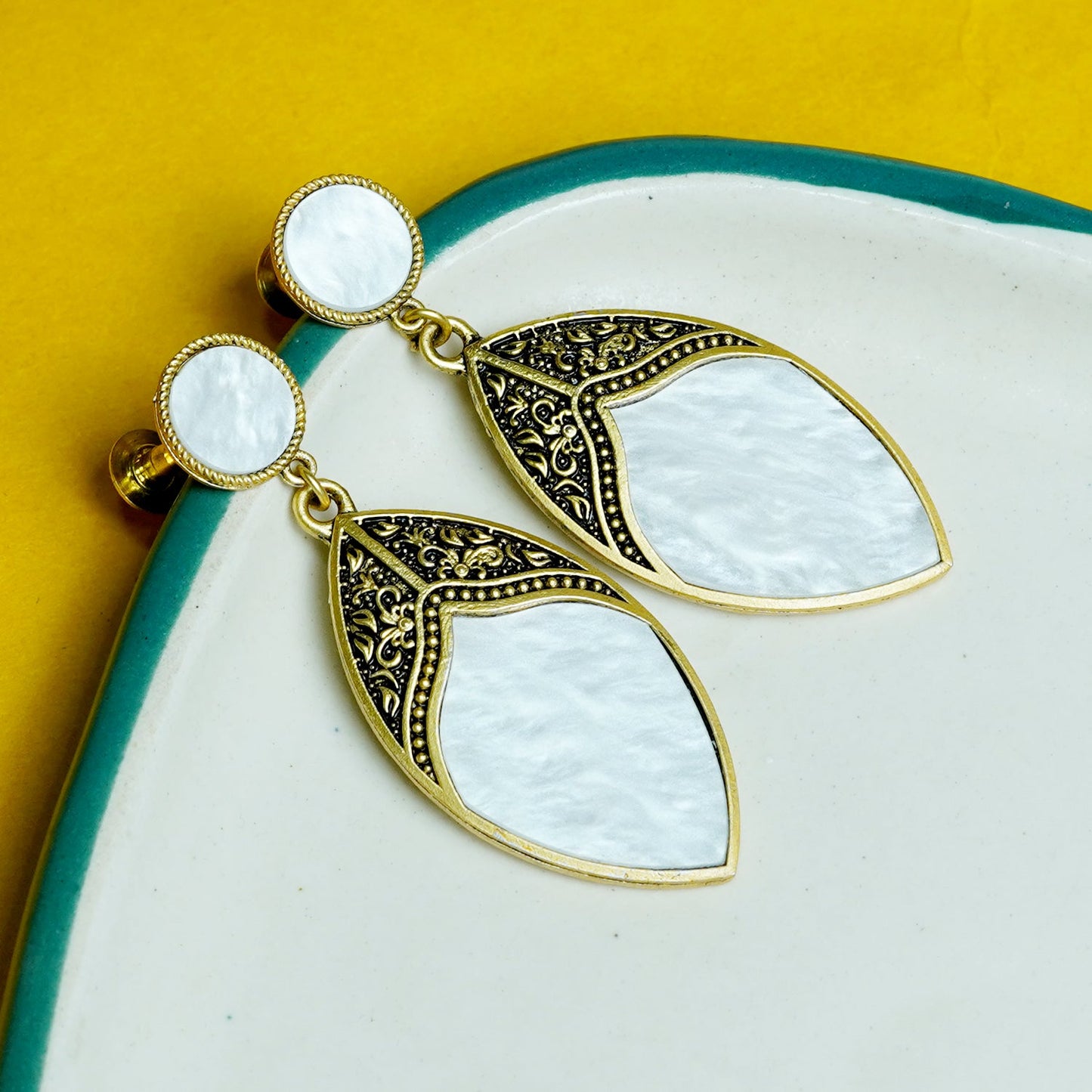 Zevar Club Gold-Toned White Leaf Drop Earrings with Antique Embossed Detailing