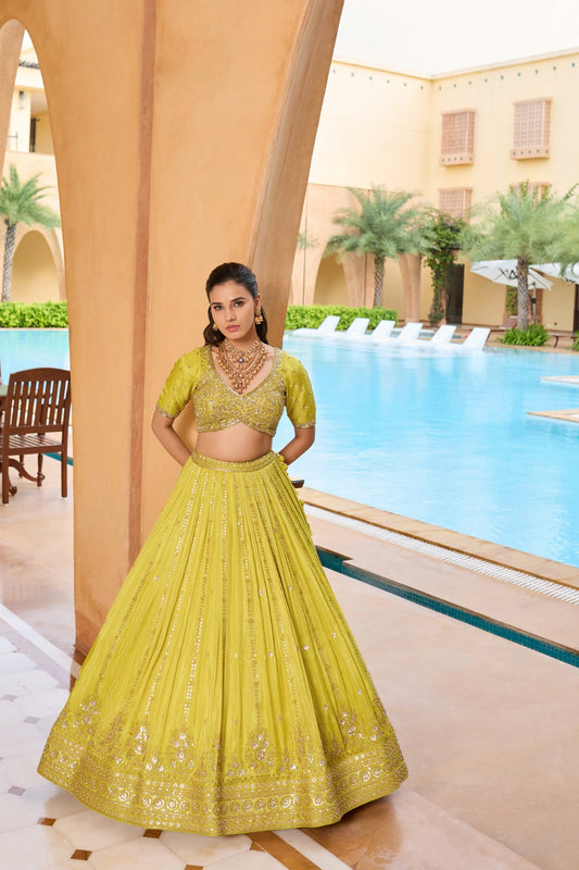 Lemon yellow silk lehenga choli with thread and sequins work