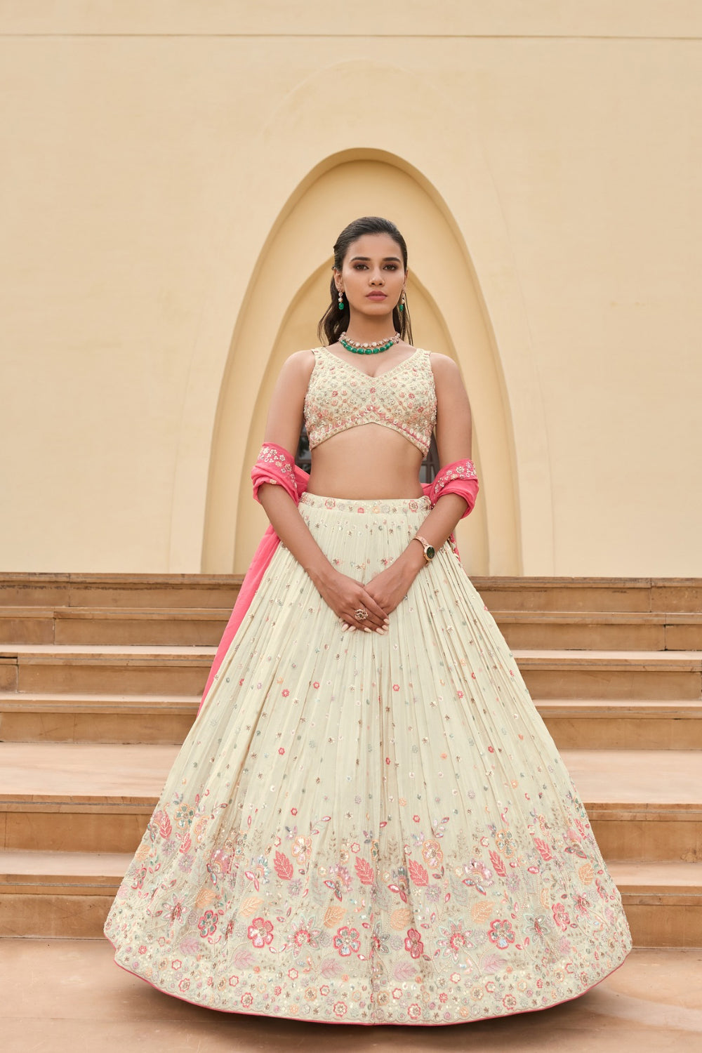 Off-white silk lehenga choli with sequins and hand cut dana work
