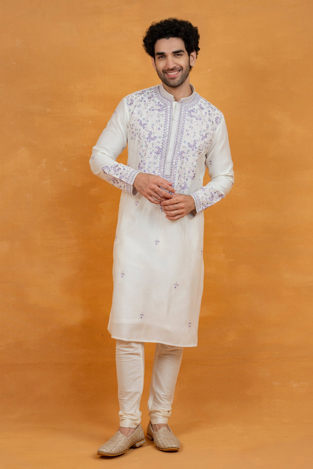 Cream silk kurta set with lavender resham embroidery and mirror work