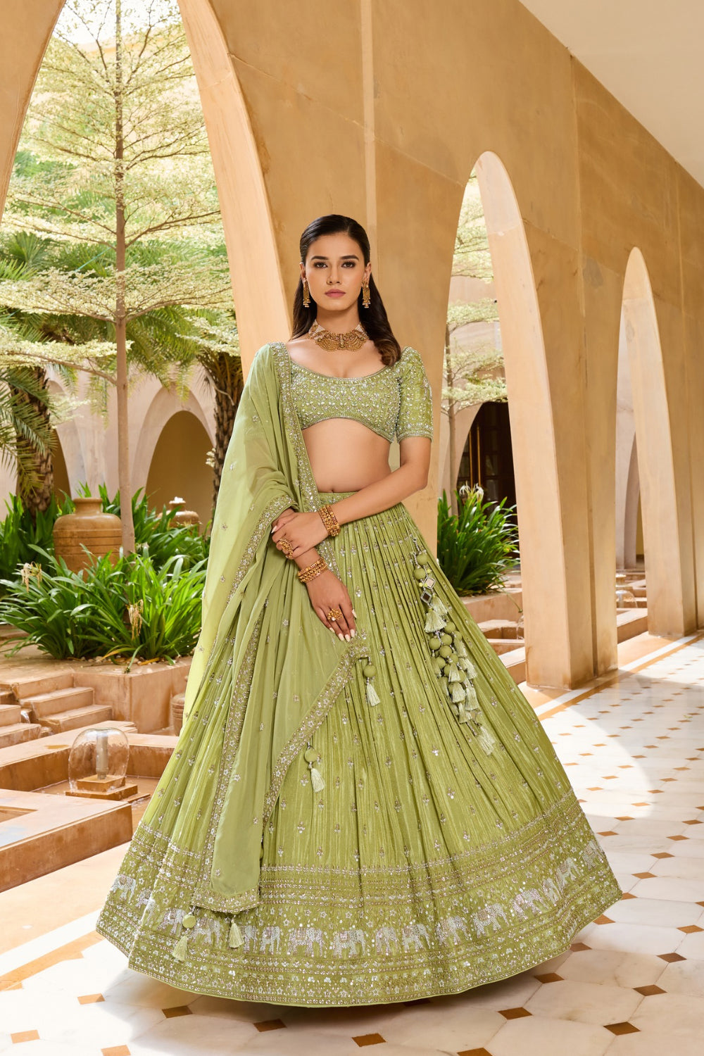 Palm green silk lehenga choli with sequins and hand cut dana work