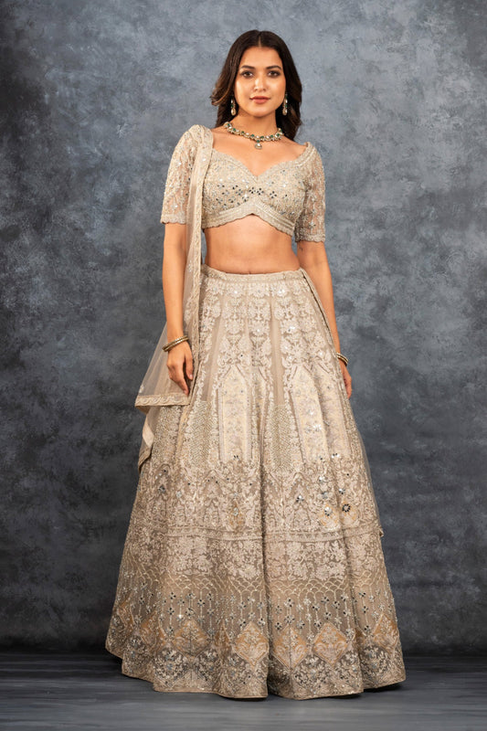 Ivory soft silk zardozi embroidered lehenga choli with hand cut dana work