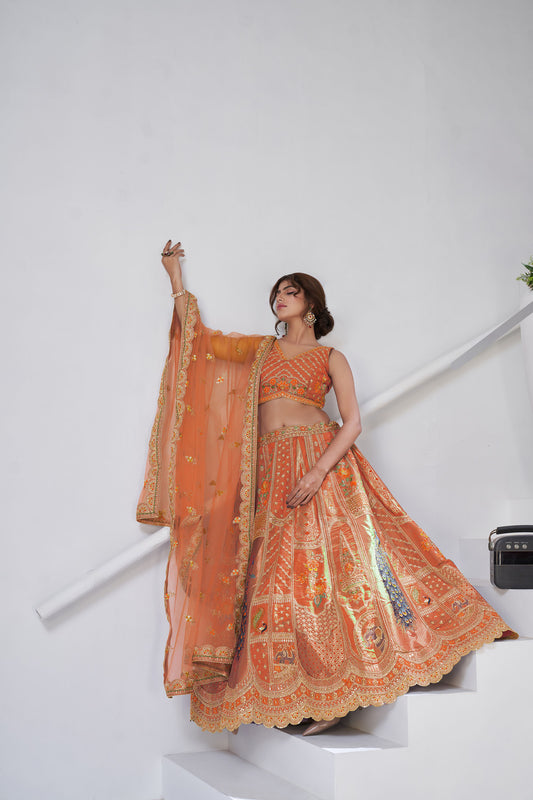 Rust Orange Raw Silk Peacock Motifs & Zari Embroidered Sangeet Lehenga