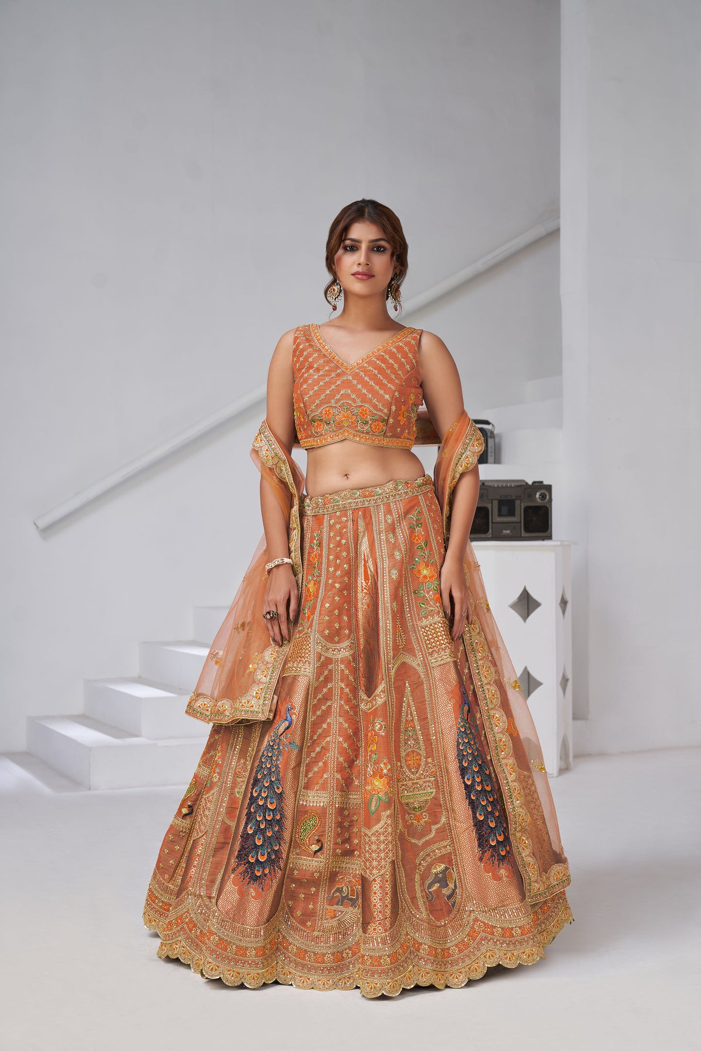 Rust Orange Raw Silk Peacock Motifs & Zari Embroidered Sangeet Lehenga
