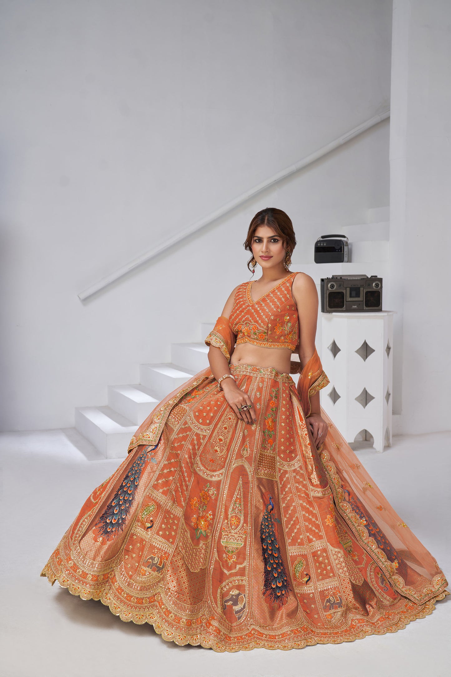 Rust Orange Raw Silk Peacock Motifs & Zari Embroidered Sangeet Lehenga