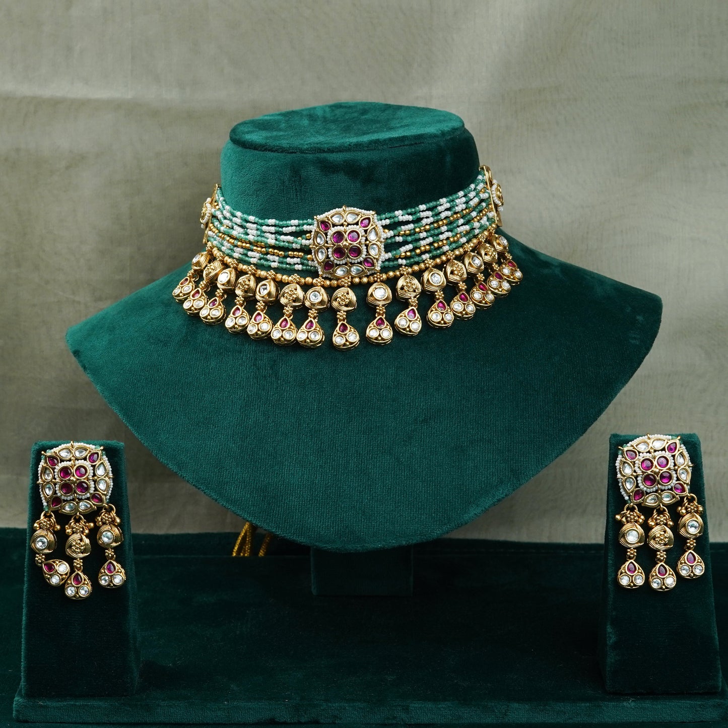 Zevar Club Gold-Tone Multi-Strand Green Beaded Ruby Pink & White Kundan Studded Royal Statement Choker Jewellery Set