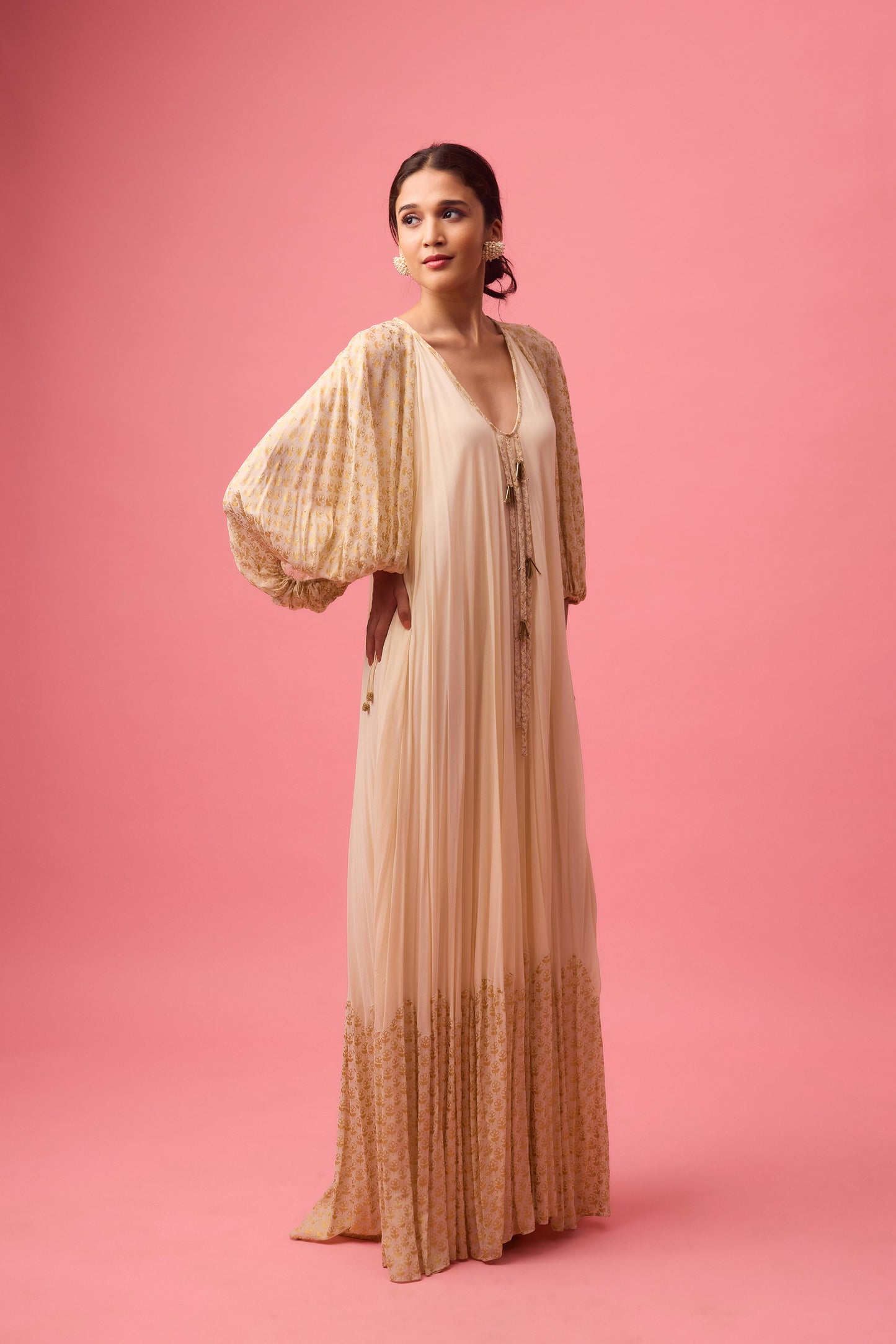 Off white Georgette dress with the detailing of foiling and dangling in sleeve