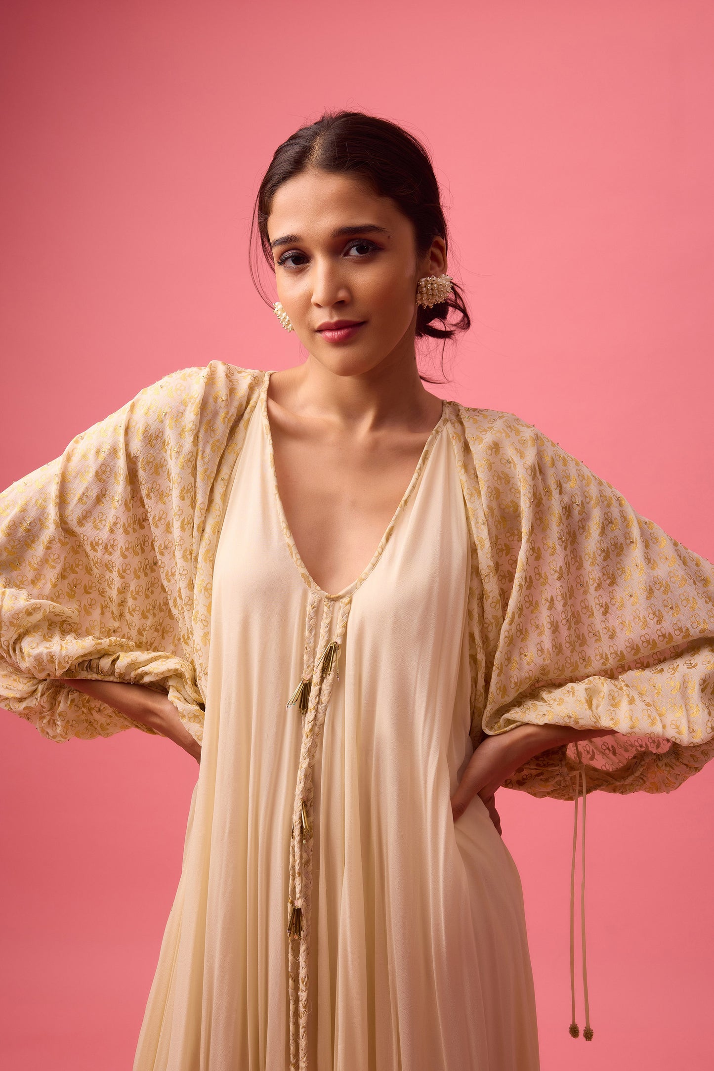 Off white Georgette dress with the detailing of foiling and dangling in sleeve