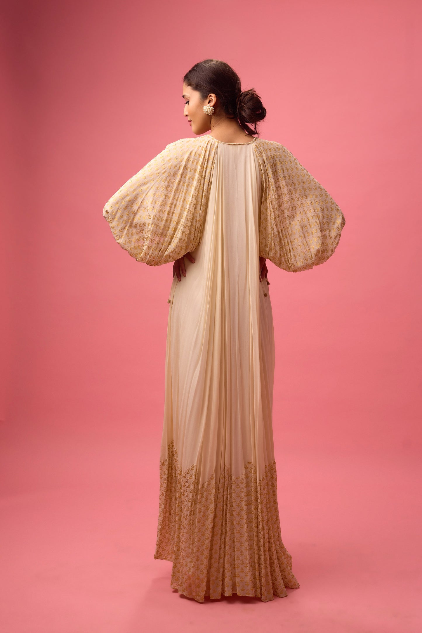 Off white Georgette dress with the detailing of foiling and dangling in sleeve