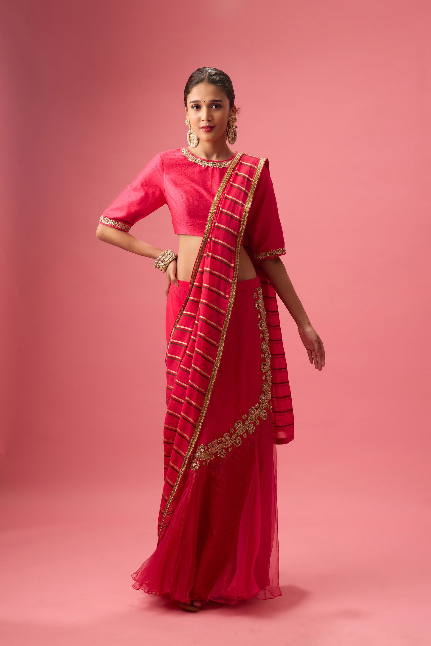 Rani Pink Double layer hand embroidered Organza lehenga paired with emb. Blouse and dupatta
