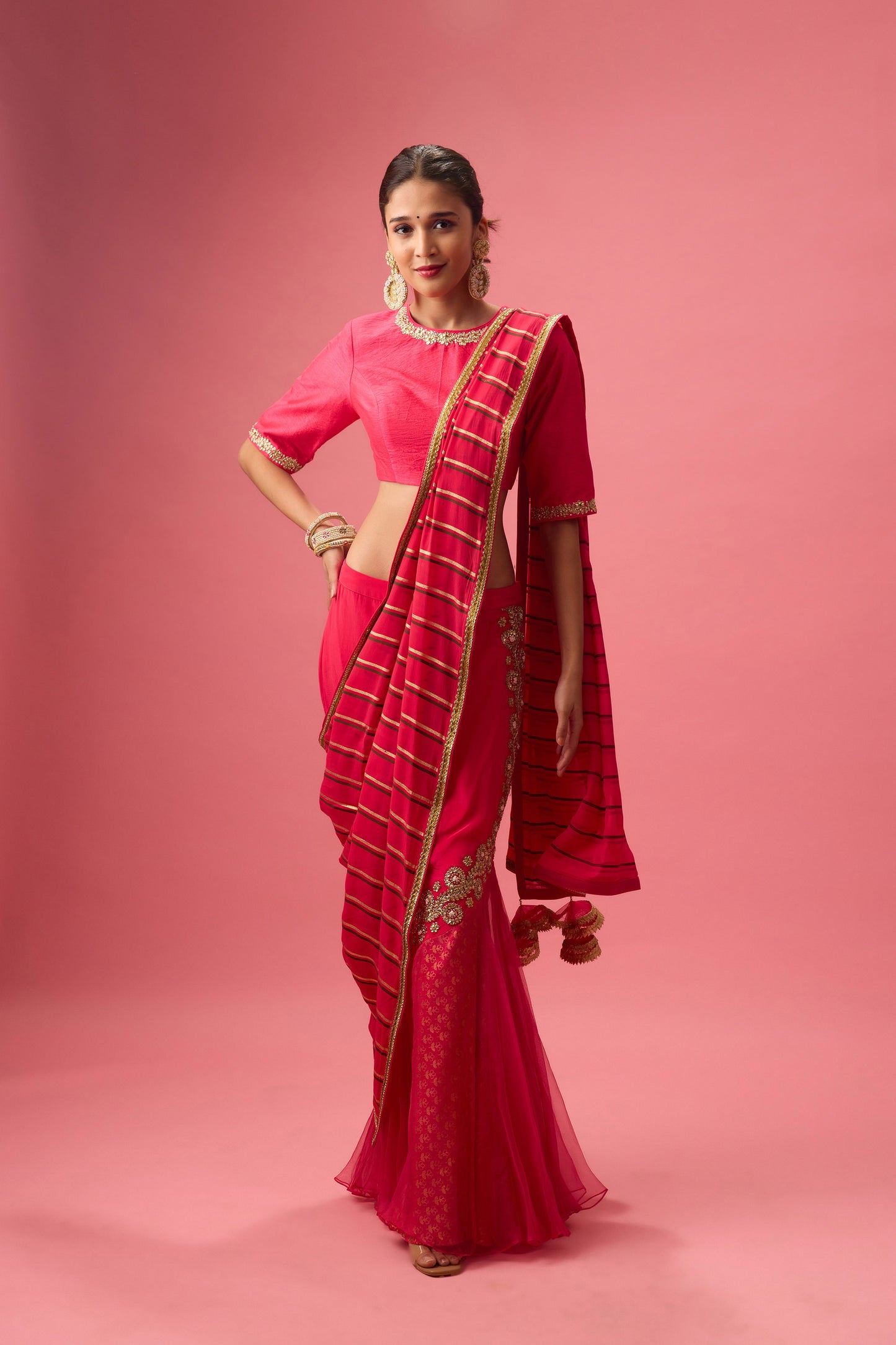 Rani Pink Double layer hand embroidered Organza lehenga paired with emb. Blouse and dupatta