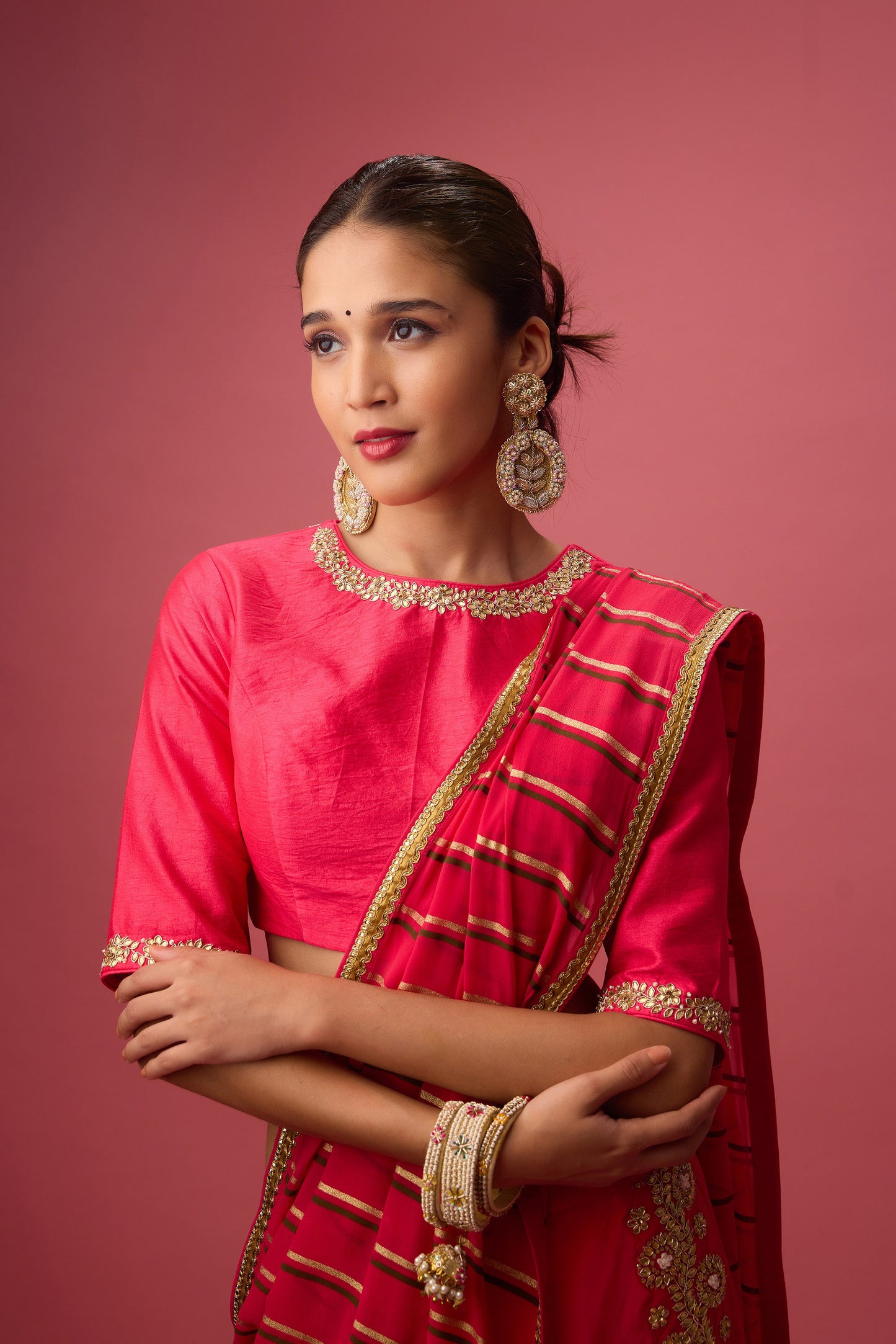 Rani Pink Double layer hand embroidered Organza lehenga paired with emb. Blouse and dupatta