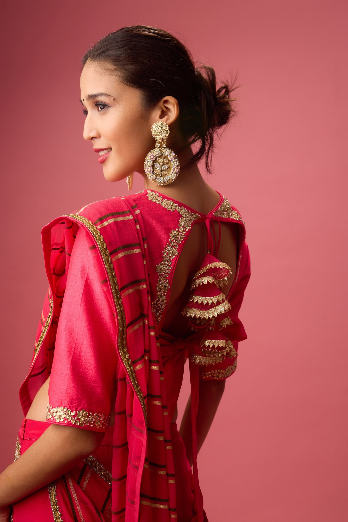 Rani Pink Double layer hand embroidered Organza lehenga paired with emb. Blouse and dupatta