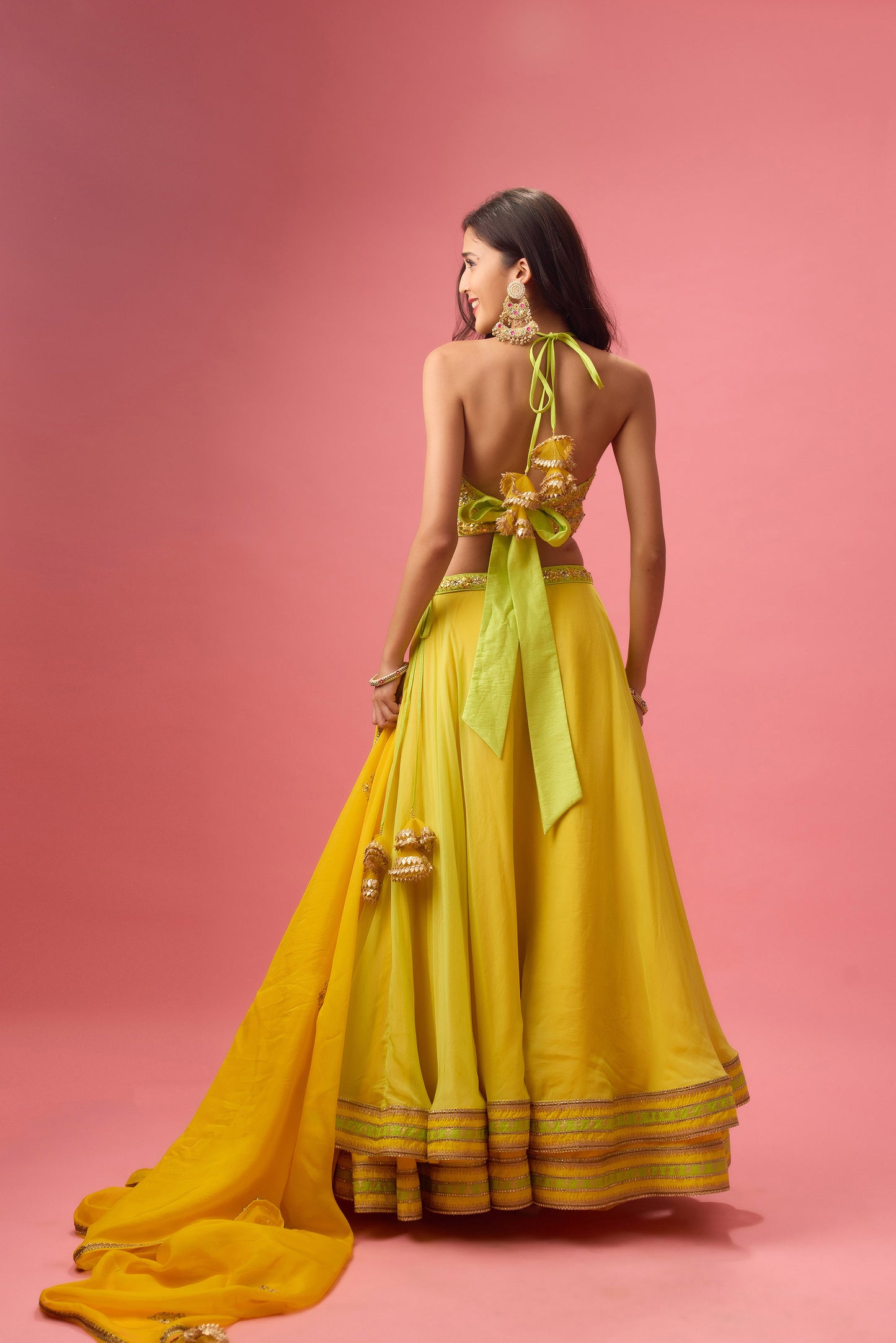 Lime green double layer organza lehenga paired with blouse &dupatta