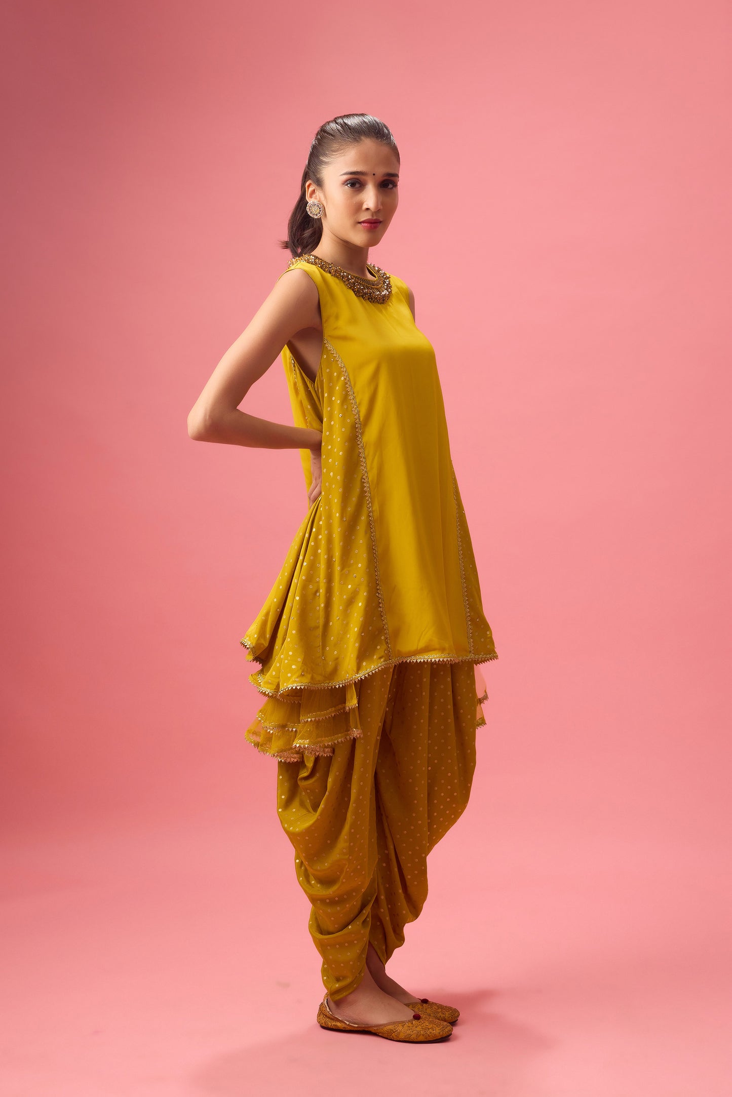 Olive kurta with foiling and hand emb. On neck paired with dhoti