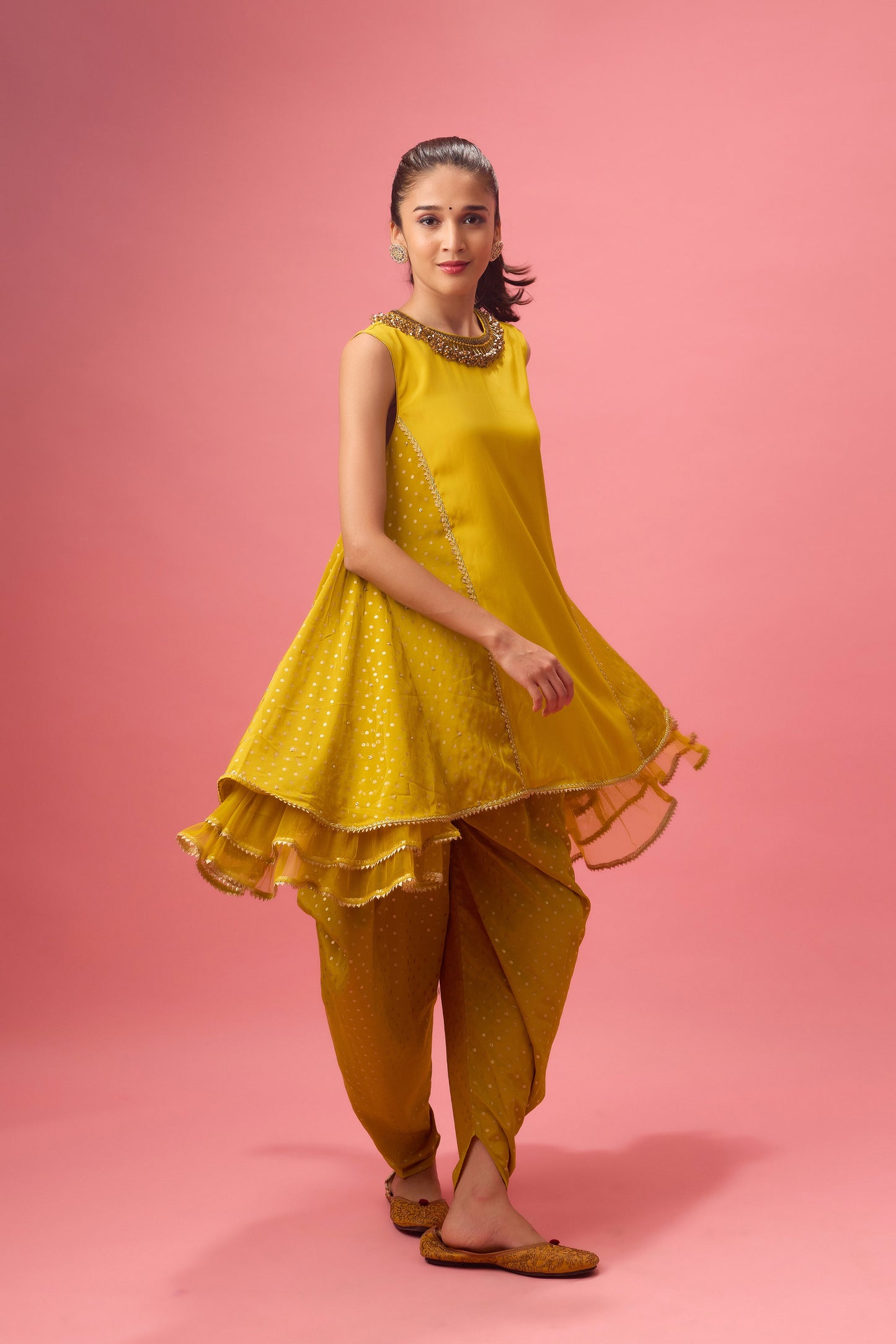 Olive kurta with foiling and hand emb. On neck paired with dhoti