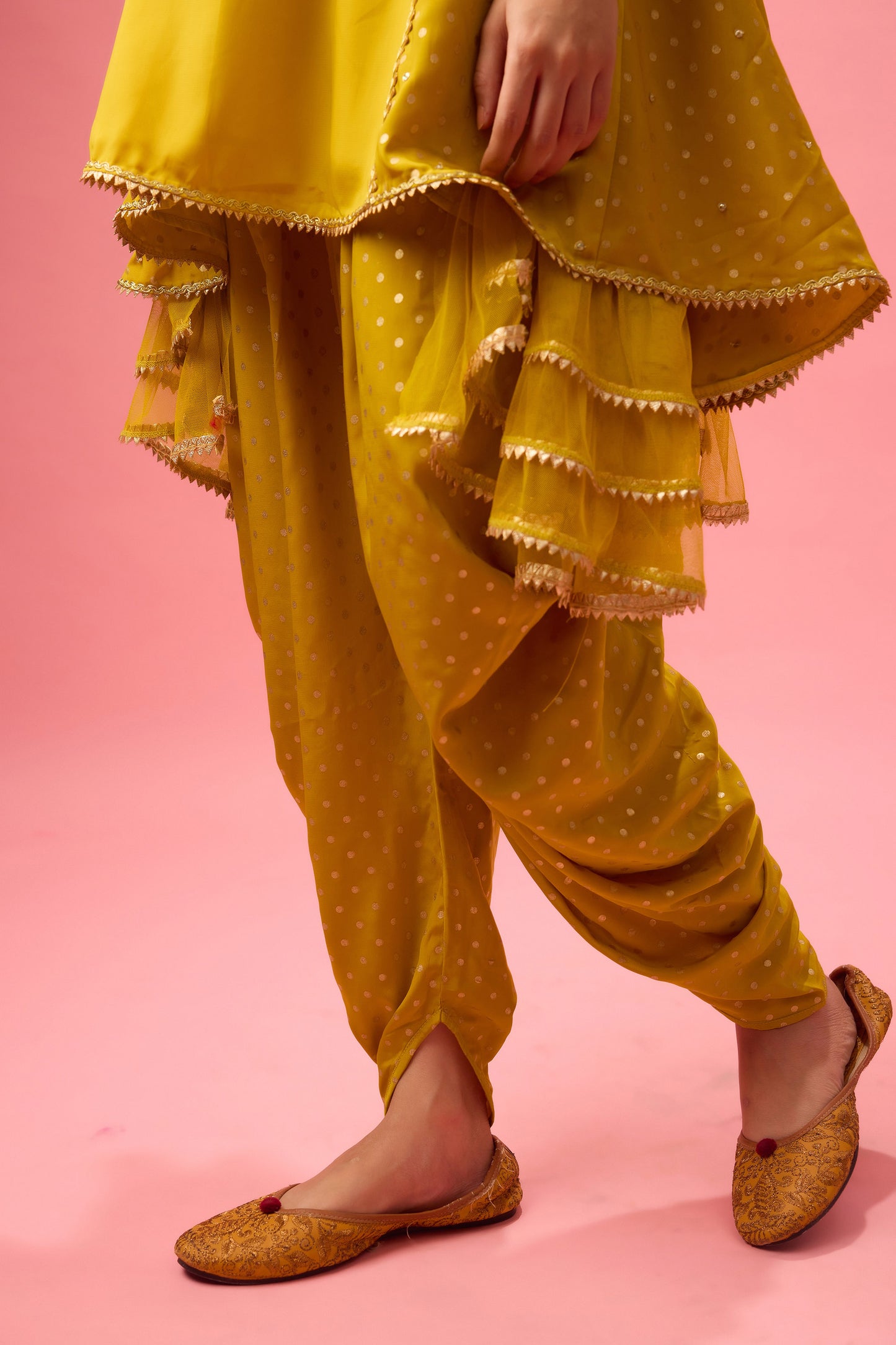 Olive kurta with foiling and hand emb. On neck paired with dhoti