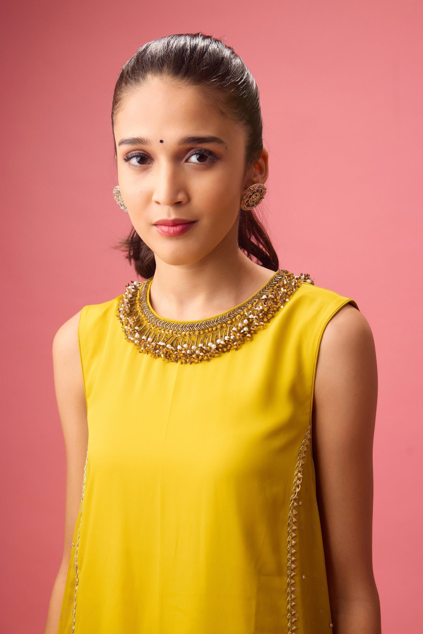 Olive kurta with foiling and hand emb. On neck paired with dhoti