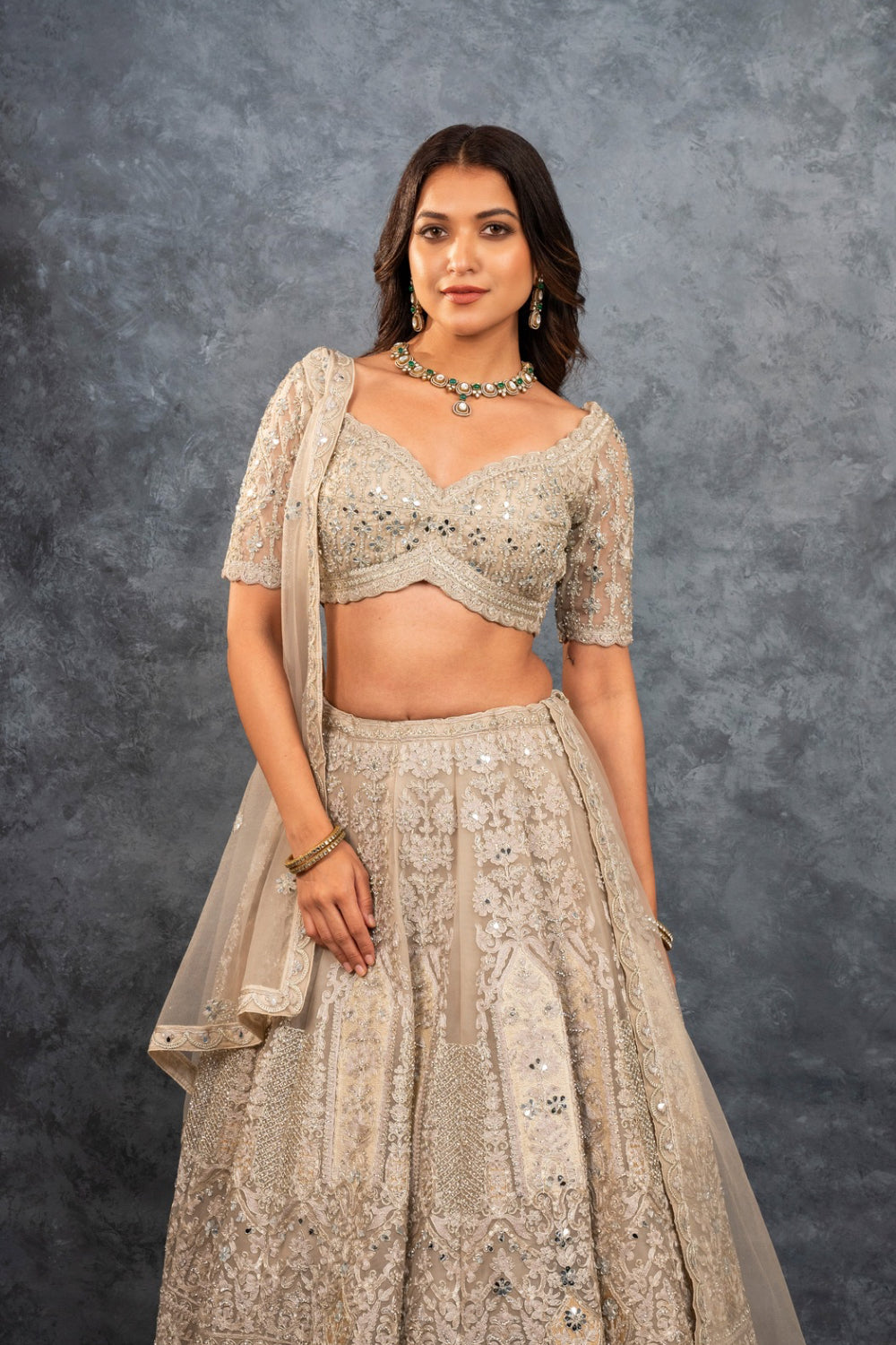 Ivory soft silk zardozi embroidered lehenga choli with hand cut dana work