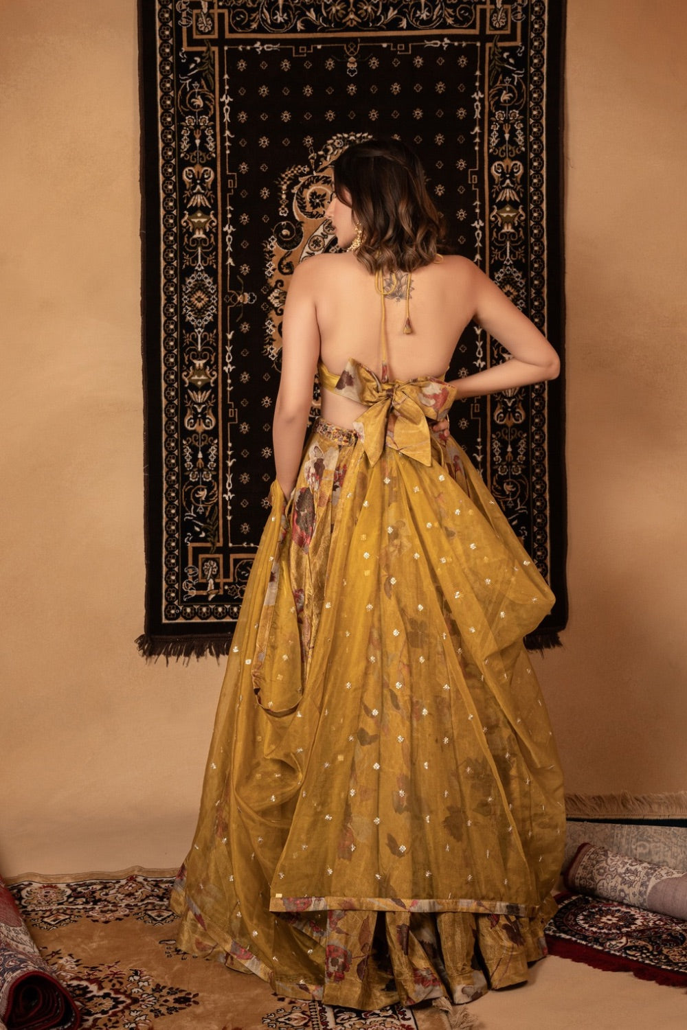 Yellow tissue silk lehenga choli with knot and cut dana work