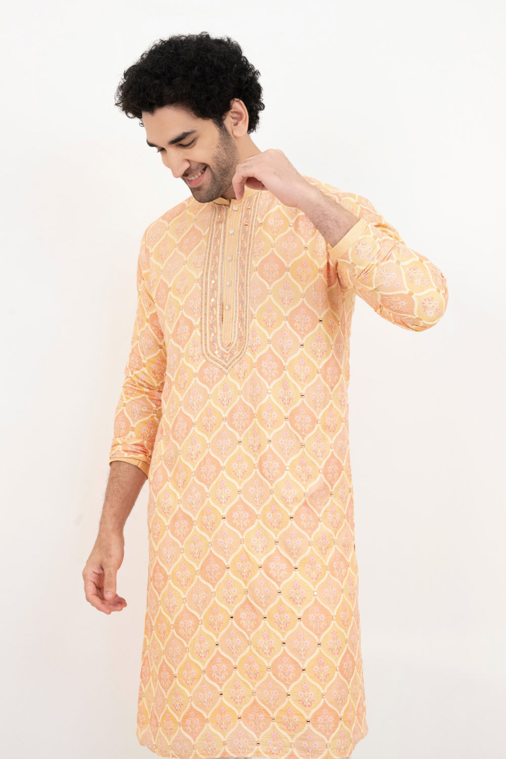 Light orange lucknowi position print kurta set with morror and thread work on yoke