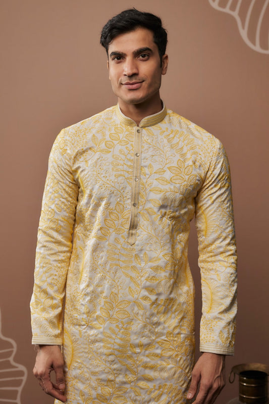 Light yellow silk kurta and pajama with hand and machine work