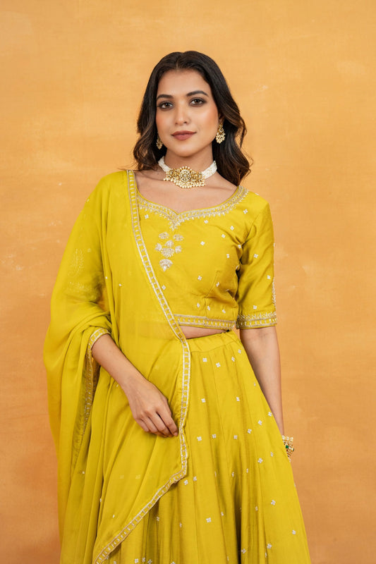Mustard yellow soft silk zardozi embroidered lehenga choli with hand cut dana and sequin work