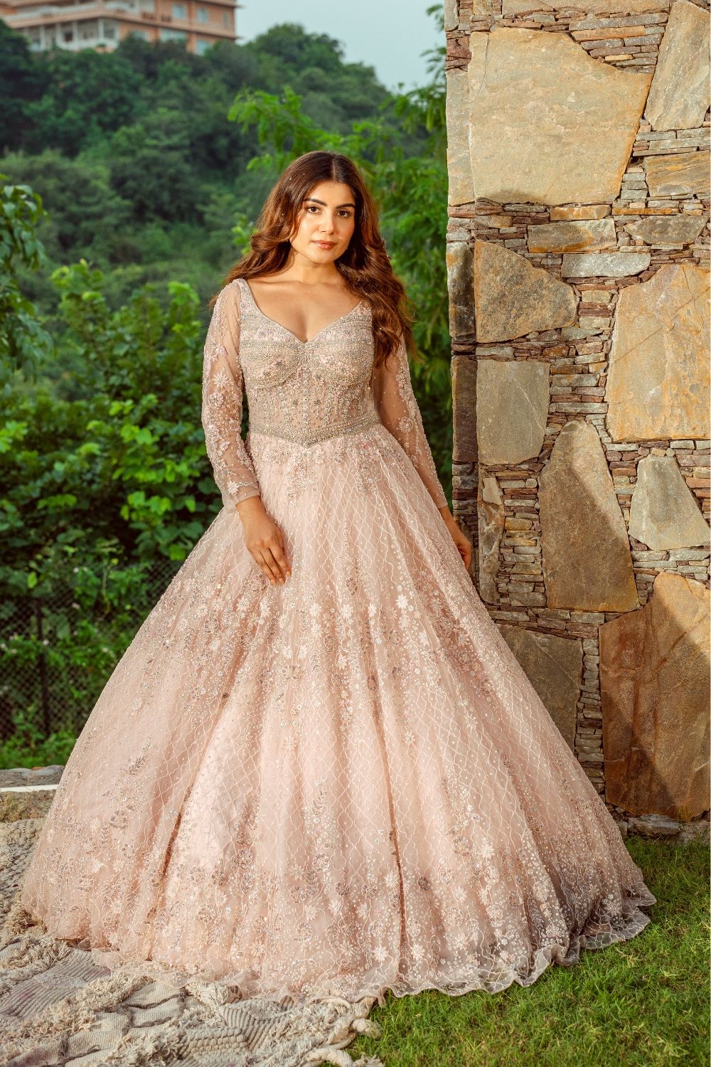Baby pink net gown with sequins and stone work