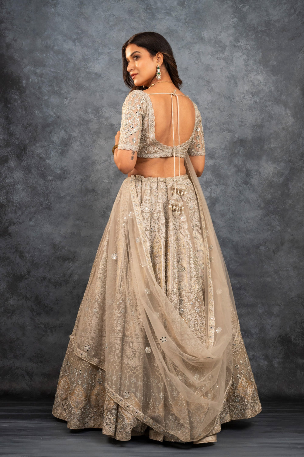 Ivory soft silk zardozi embroidered lehenga choli with hand cut dana work