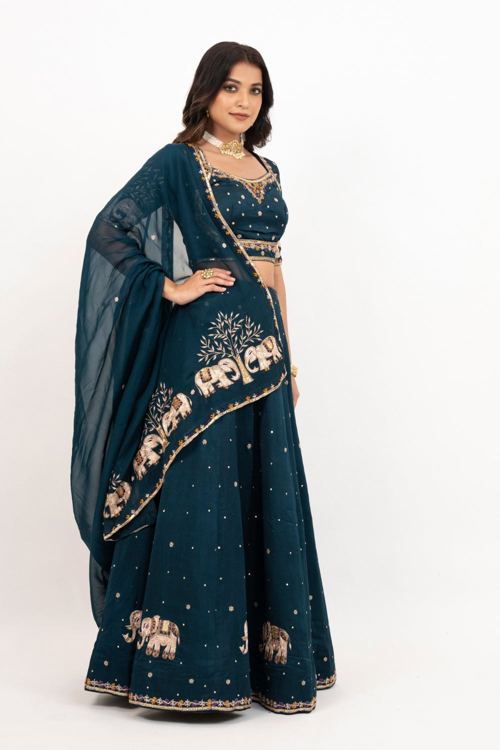 Peacock blue soft silk zardozi embroidered lehenga choli with hand cut dana work