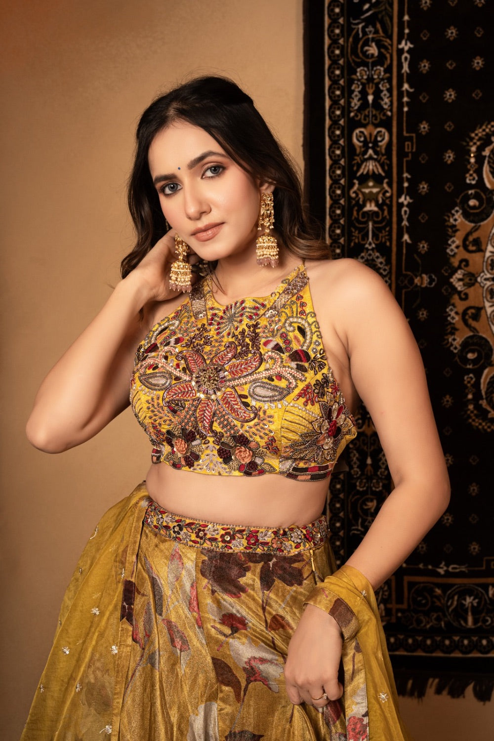 Yellow tissue silk lehenga choli with knot and cut dana work
