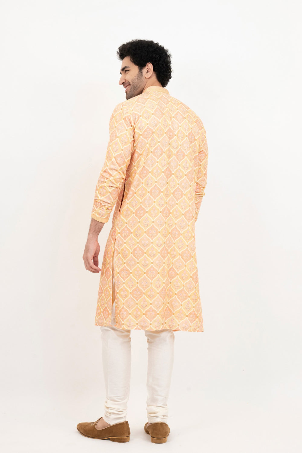 Light orange lucknowi position print kurta set with morror and thread work on yoke